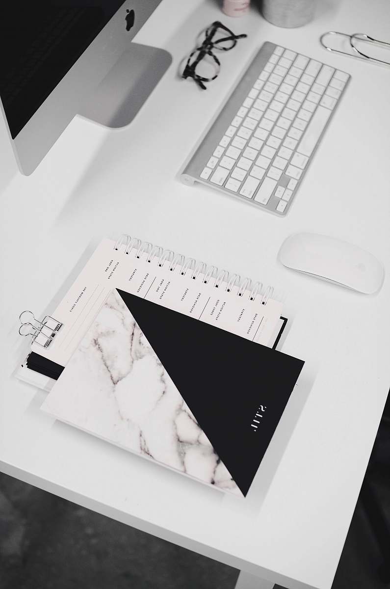 desk white and black notebook black-and-white