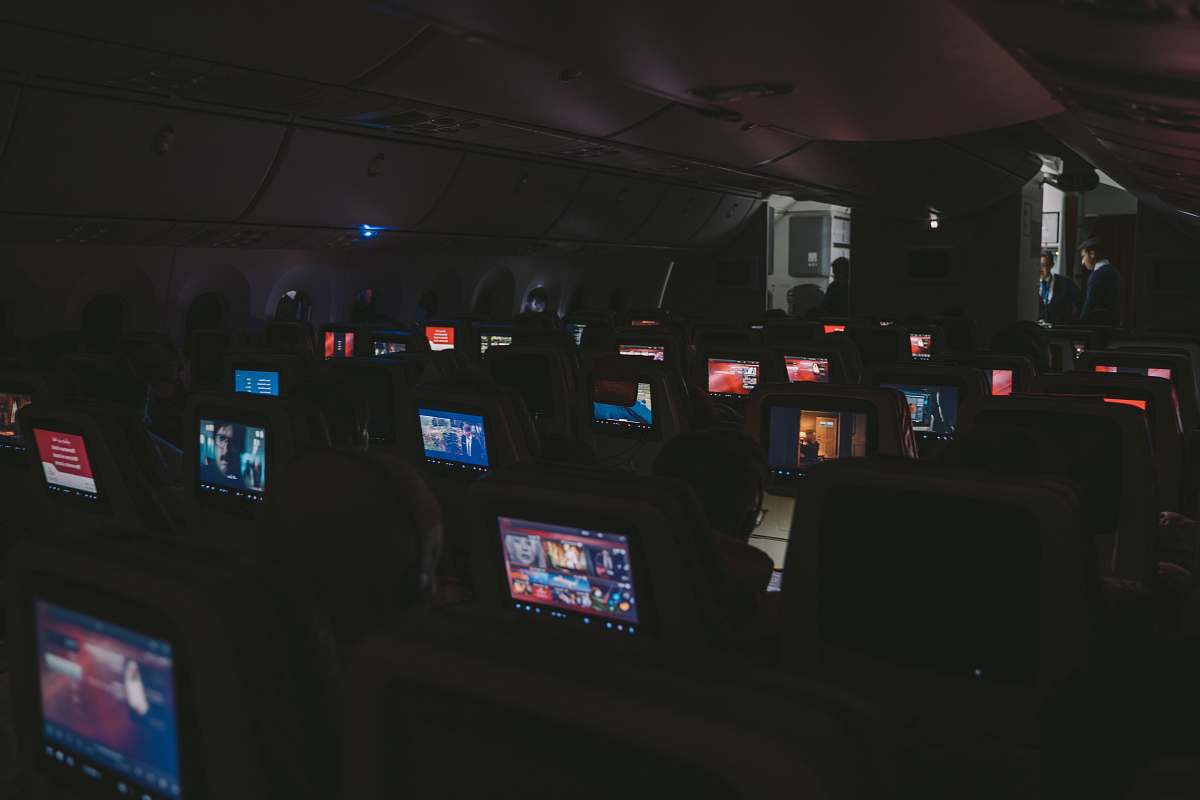 person airplane seat with flat screen TV rack arcade game machine