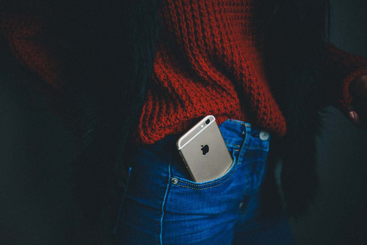person gold iPhone 6 on person's pocket people