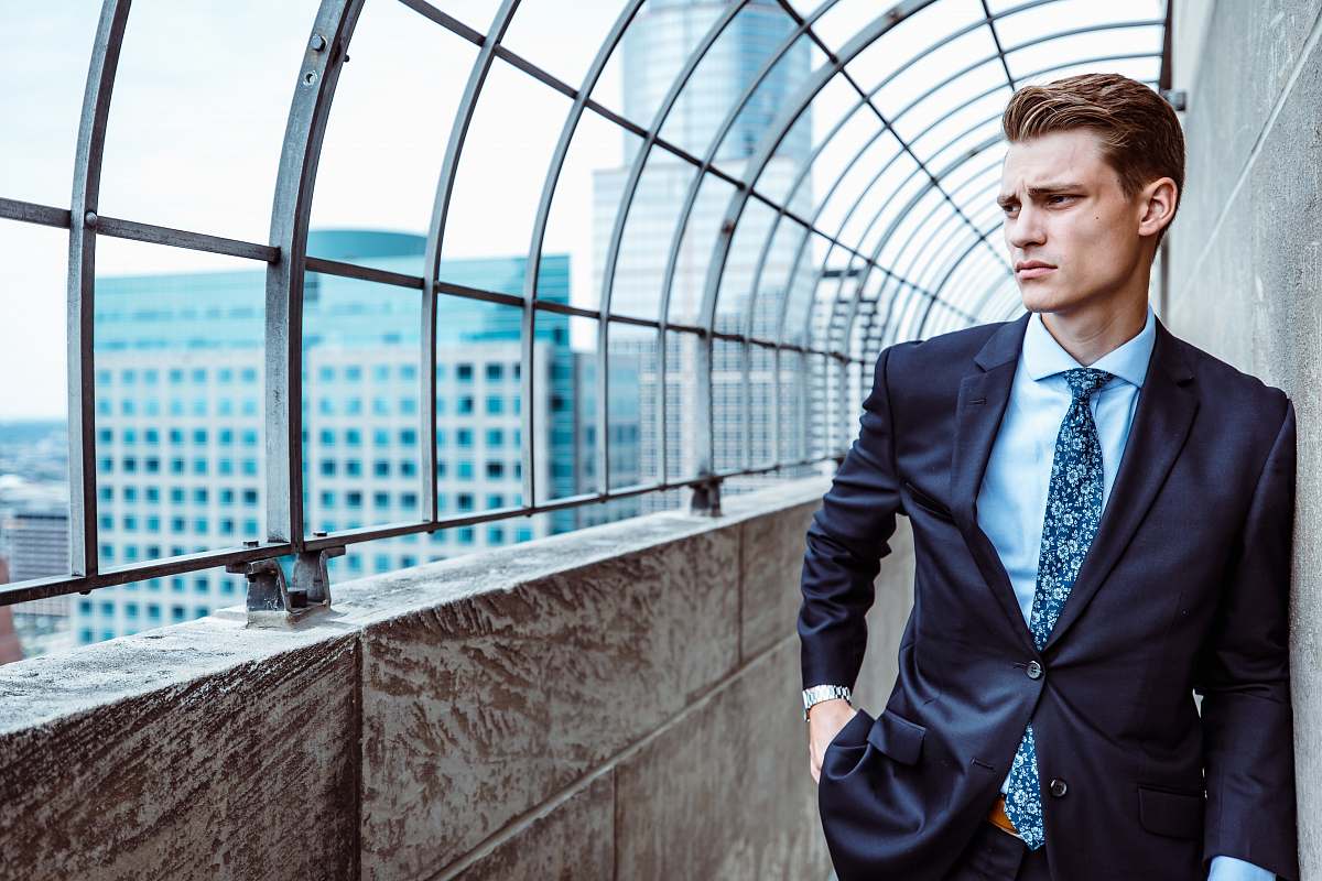 suit man facing sideways people