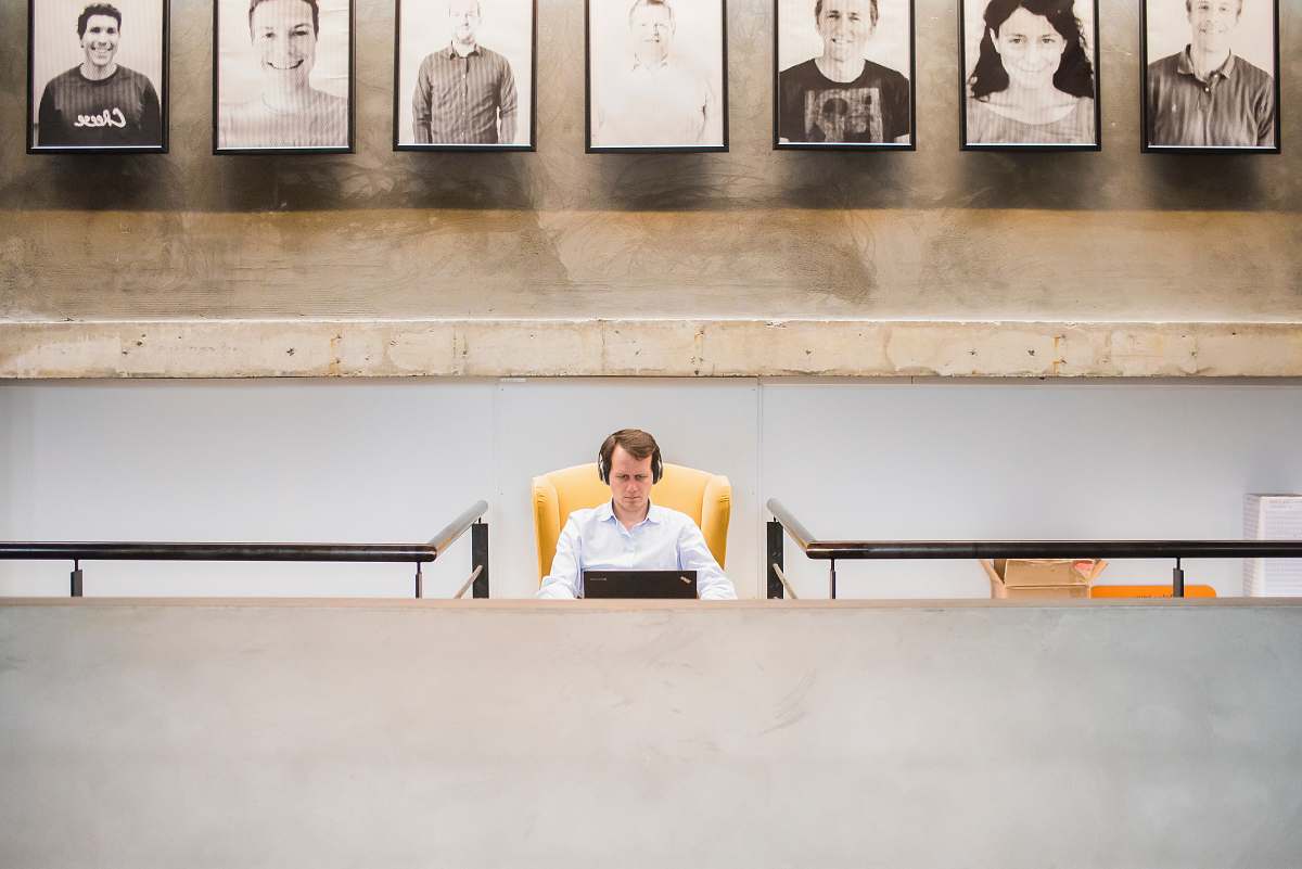 person man in white dress shirt using black laptop office