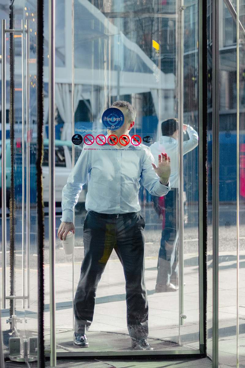 person man leaning on glass door people