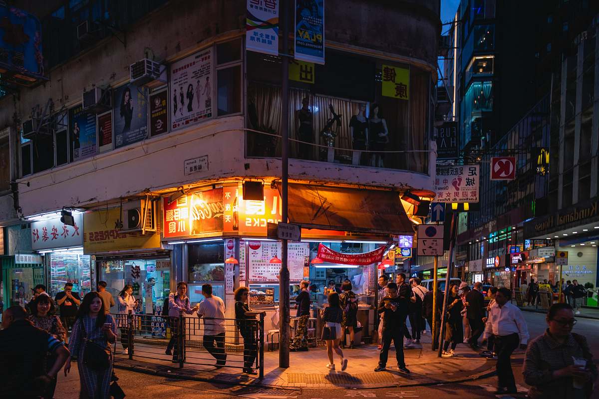person people walking on street during nighttime pedestrian