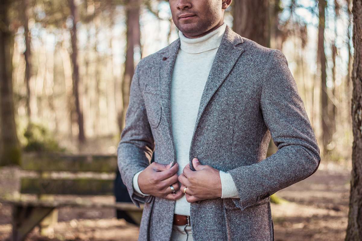 person person holding gray coat people