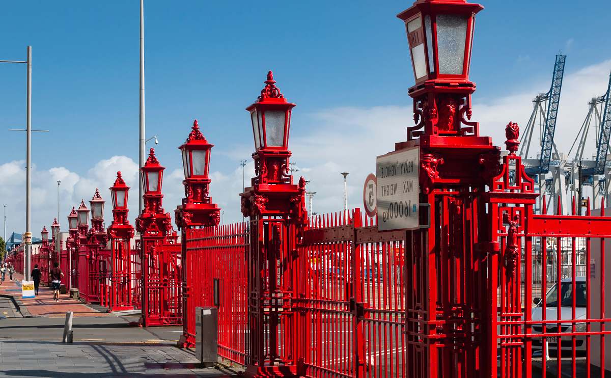 person shallow focus photo of lamp posts architecture