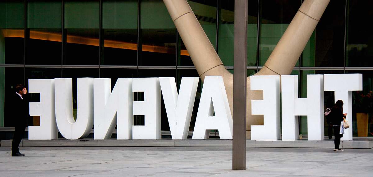 person The Avenue sign architecture