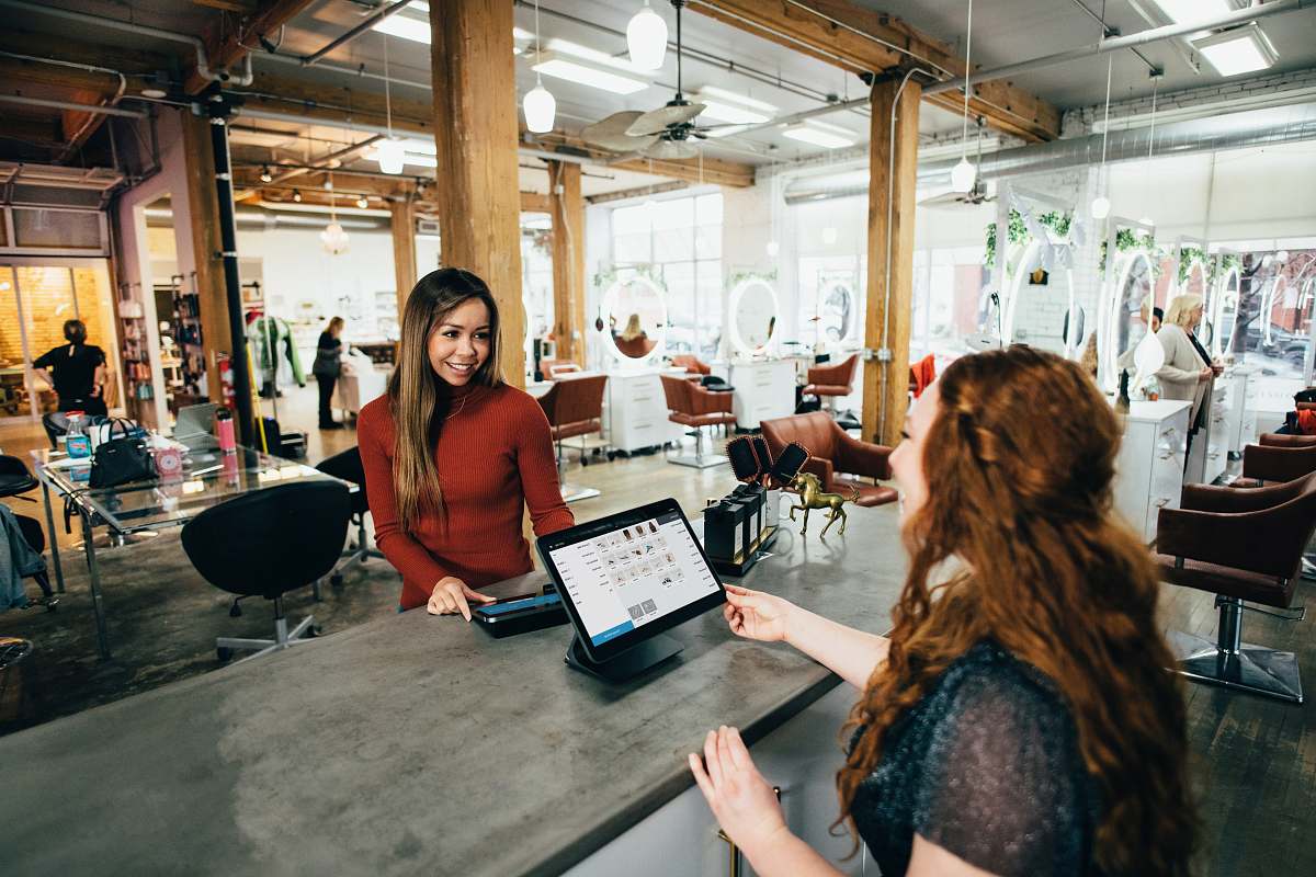 person two women near tables furniture