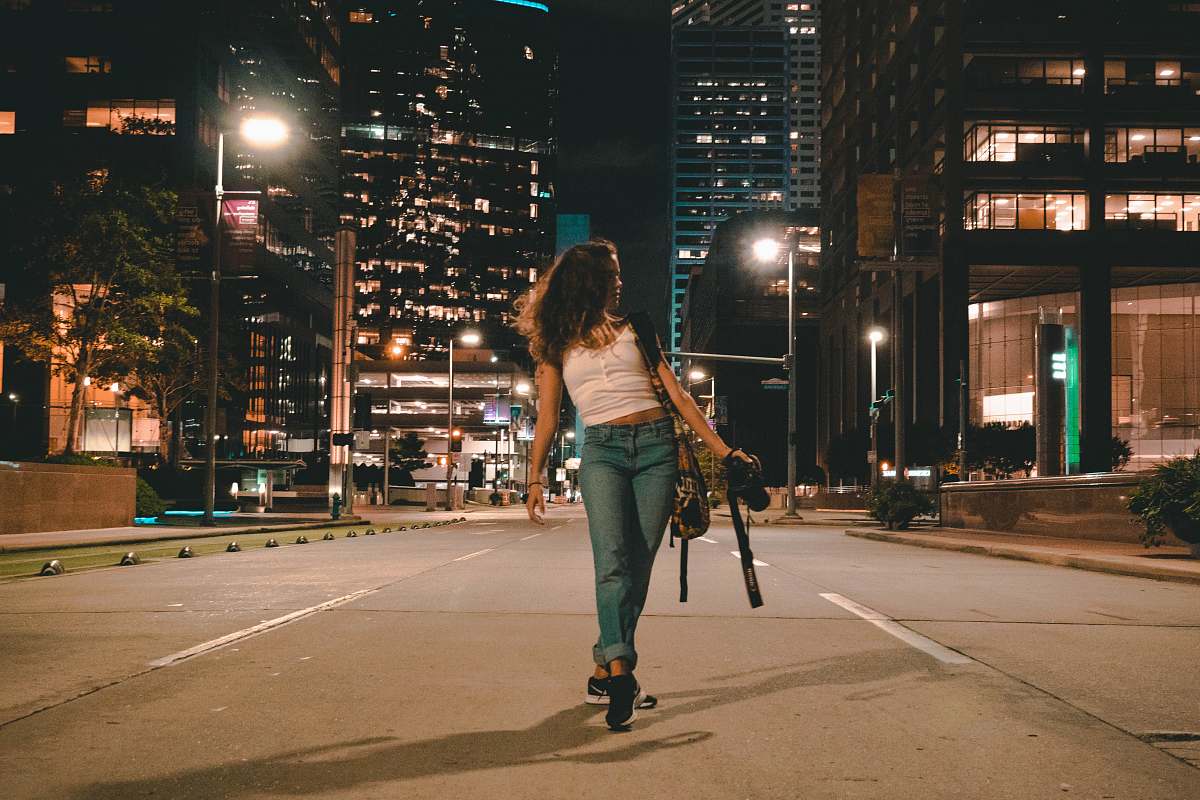 person woman holding DSLR camera apparel