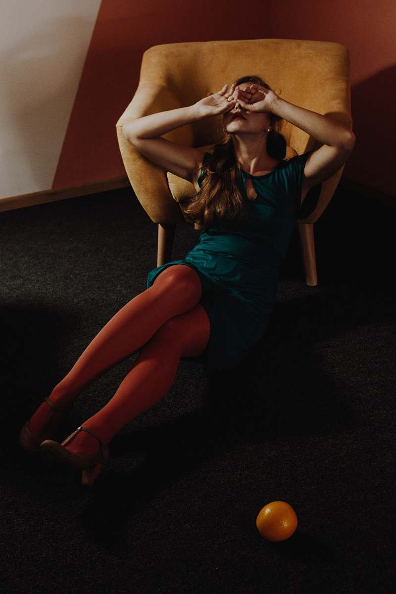 person woman leaning on armchair people