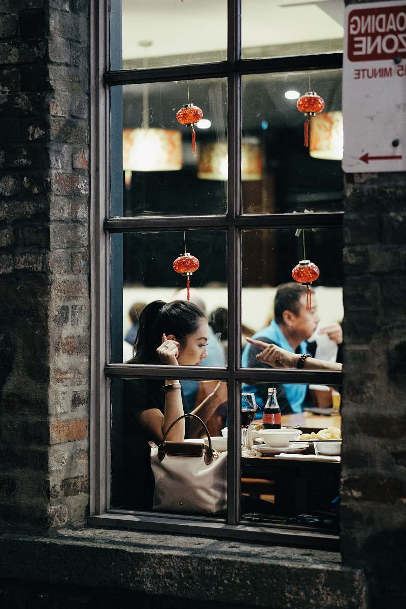 people woman leaning on table person