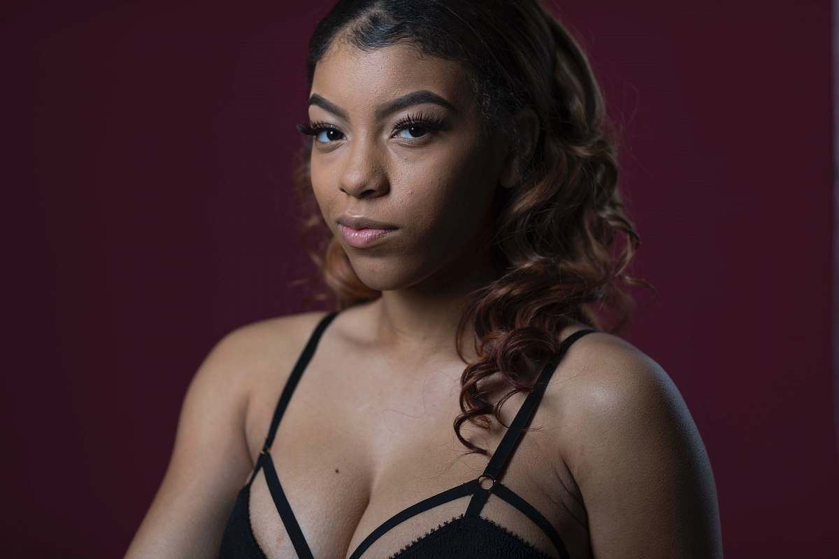 person woman wearing black bra face
