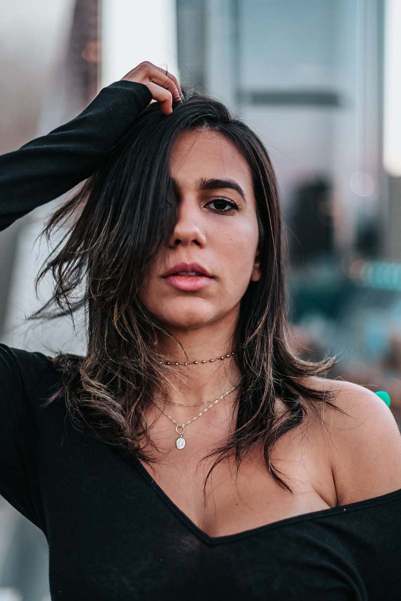 person woman wearing black scoop-neck long-sleeved shirt people