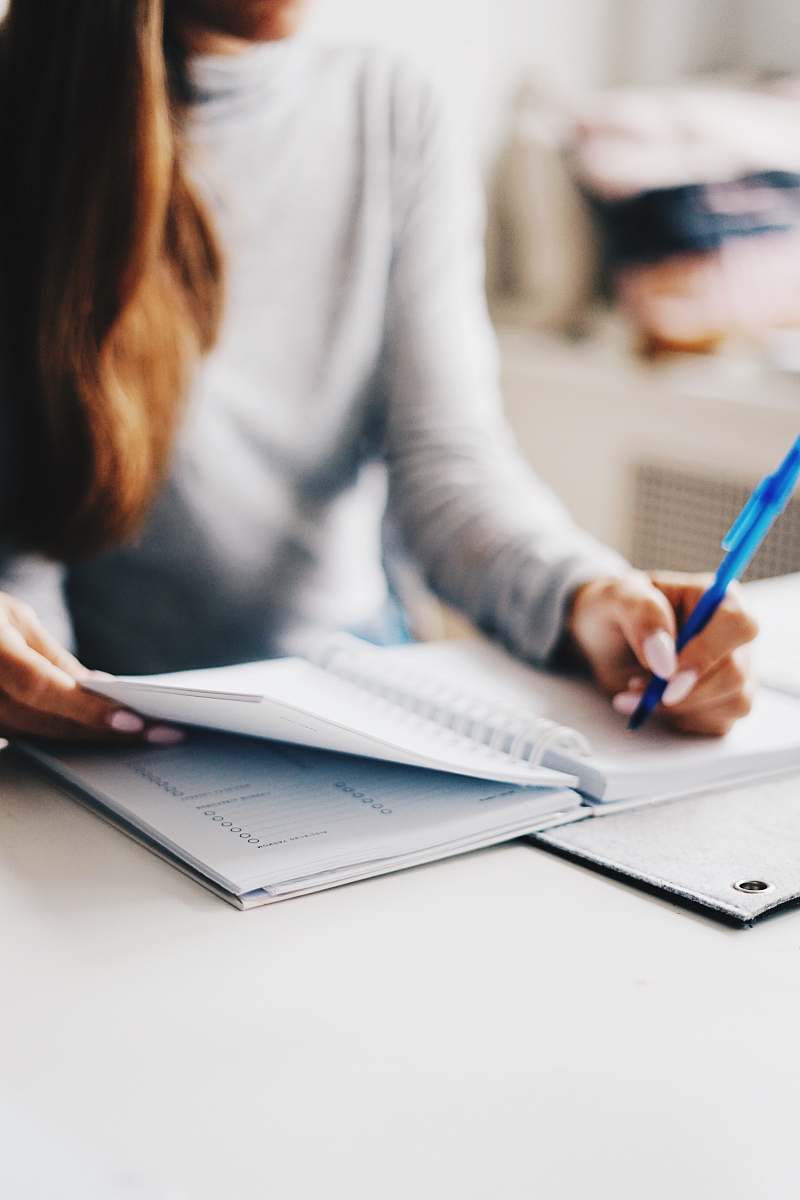 person woman writing using pen work