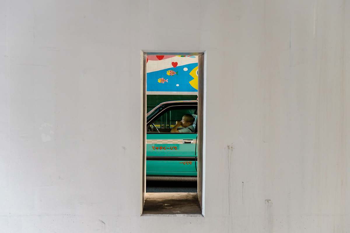 ebisu person sitting in teal car shibuya