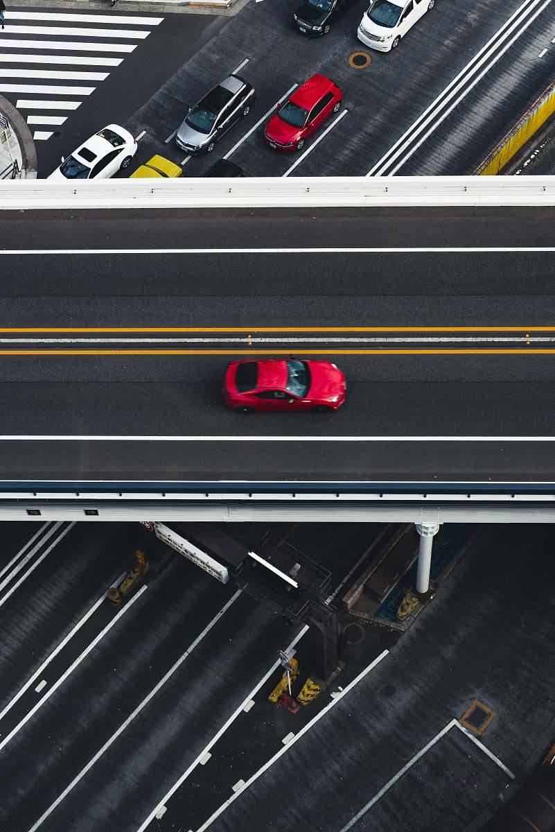 road red car on super highway aerial photography intersection