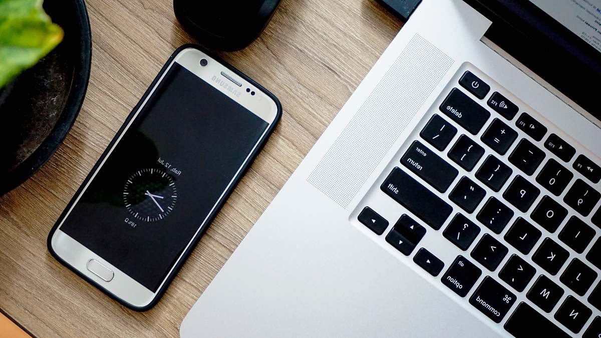 electronics smartphone beside MacBook Pro phone