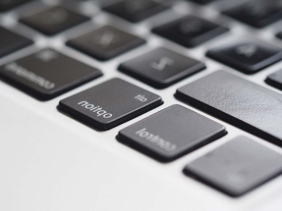 hardware tilt shift lens photography of laptop computer key cap computer hardware