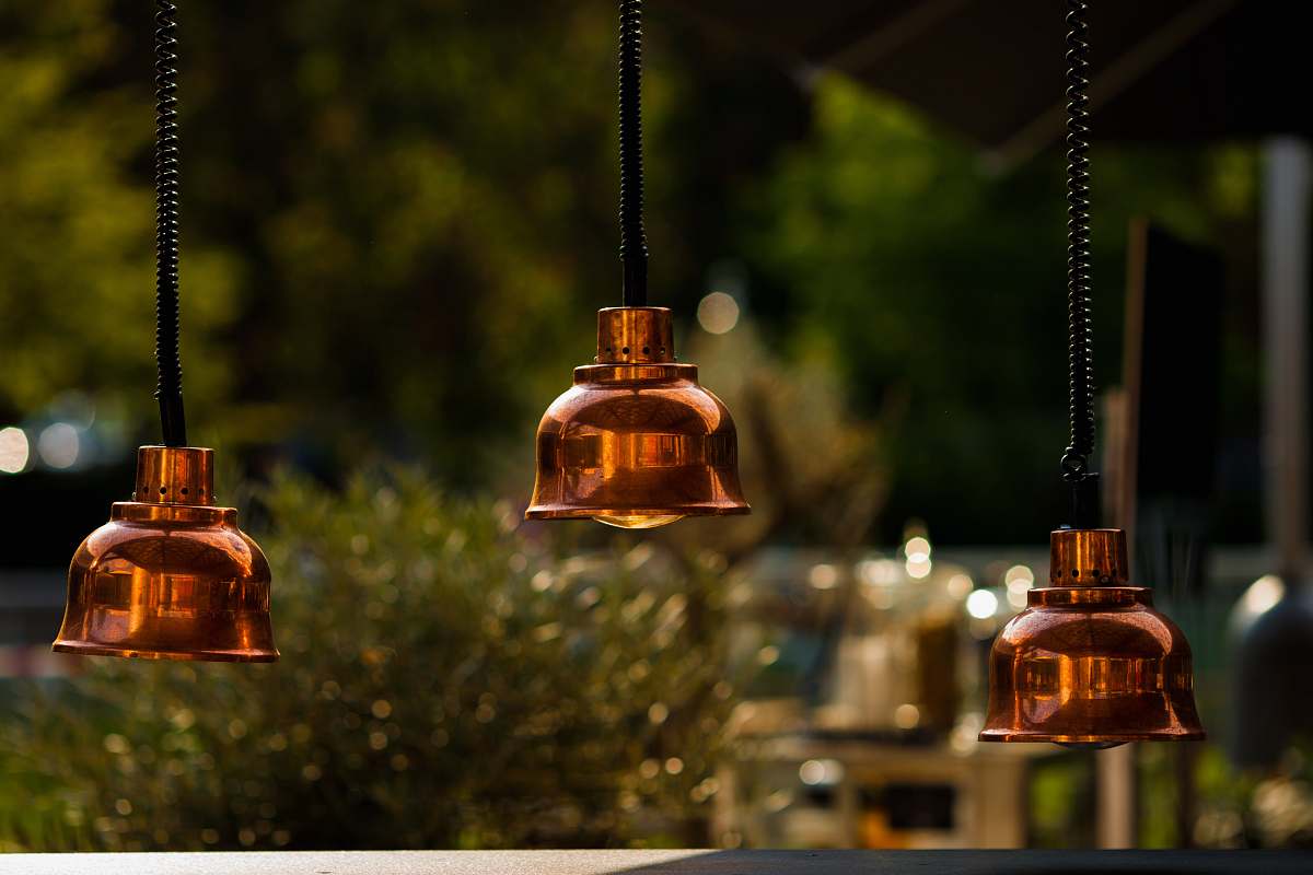 copper photo of brown 3-bulb pendant lamps lamp