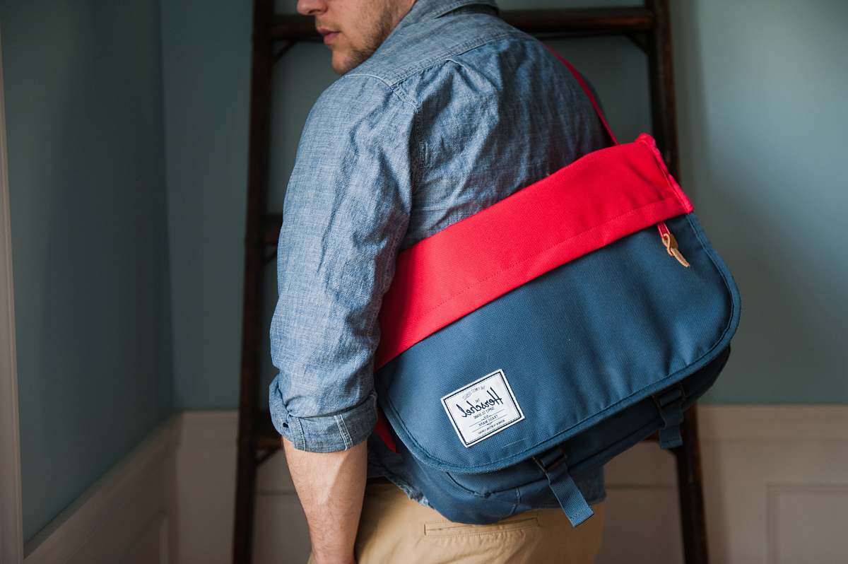 bag man carrying bag shirt