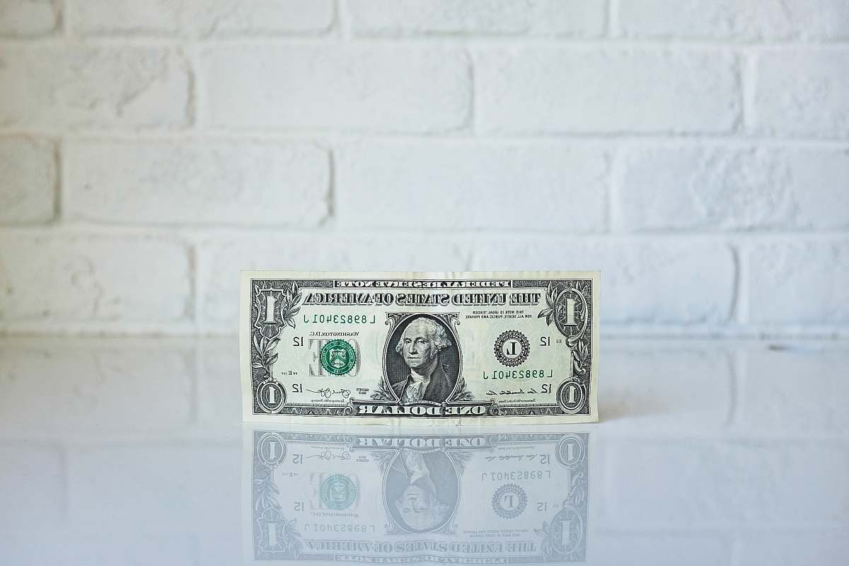 equity 1 U.S. dollar banknote on white surface dollar