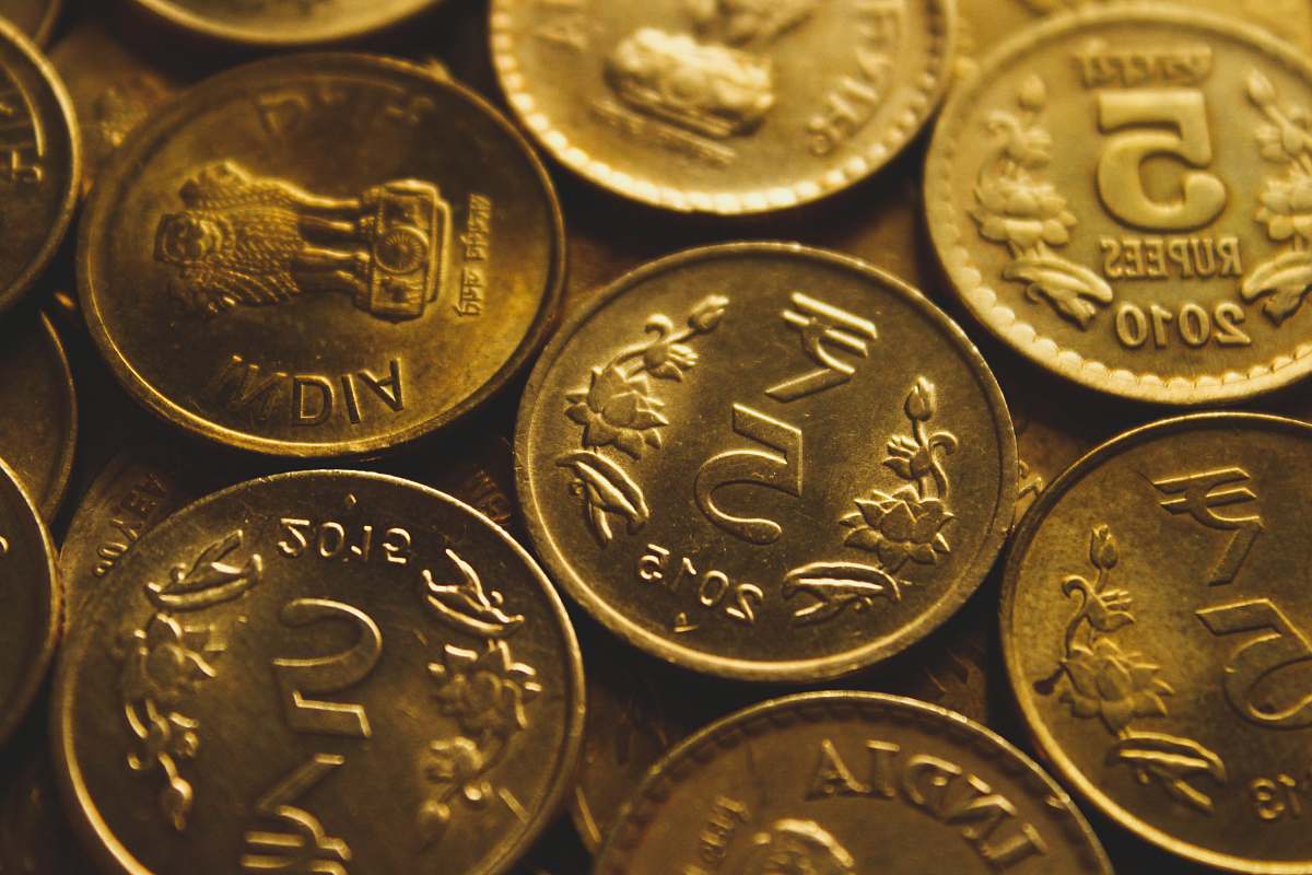 coin round gold-colored coin lot close-up photography wristwatch