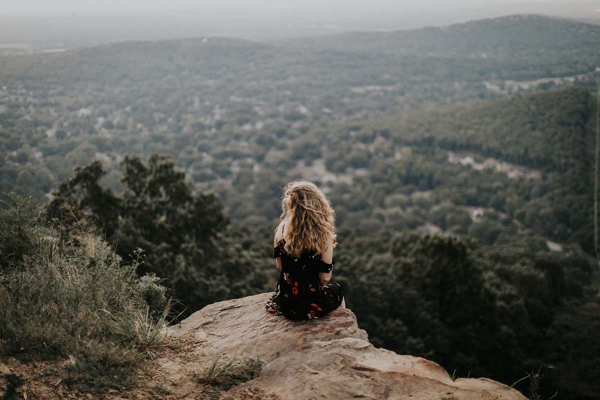 nature woman siting on cliff female