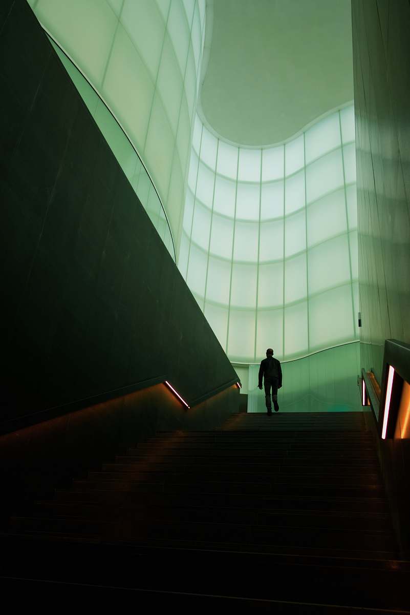 milano man walking on stair inside building italy