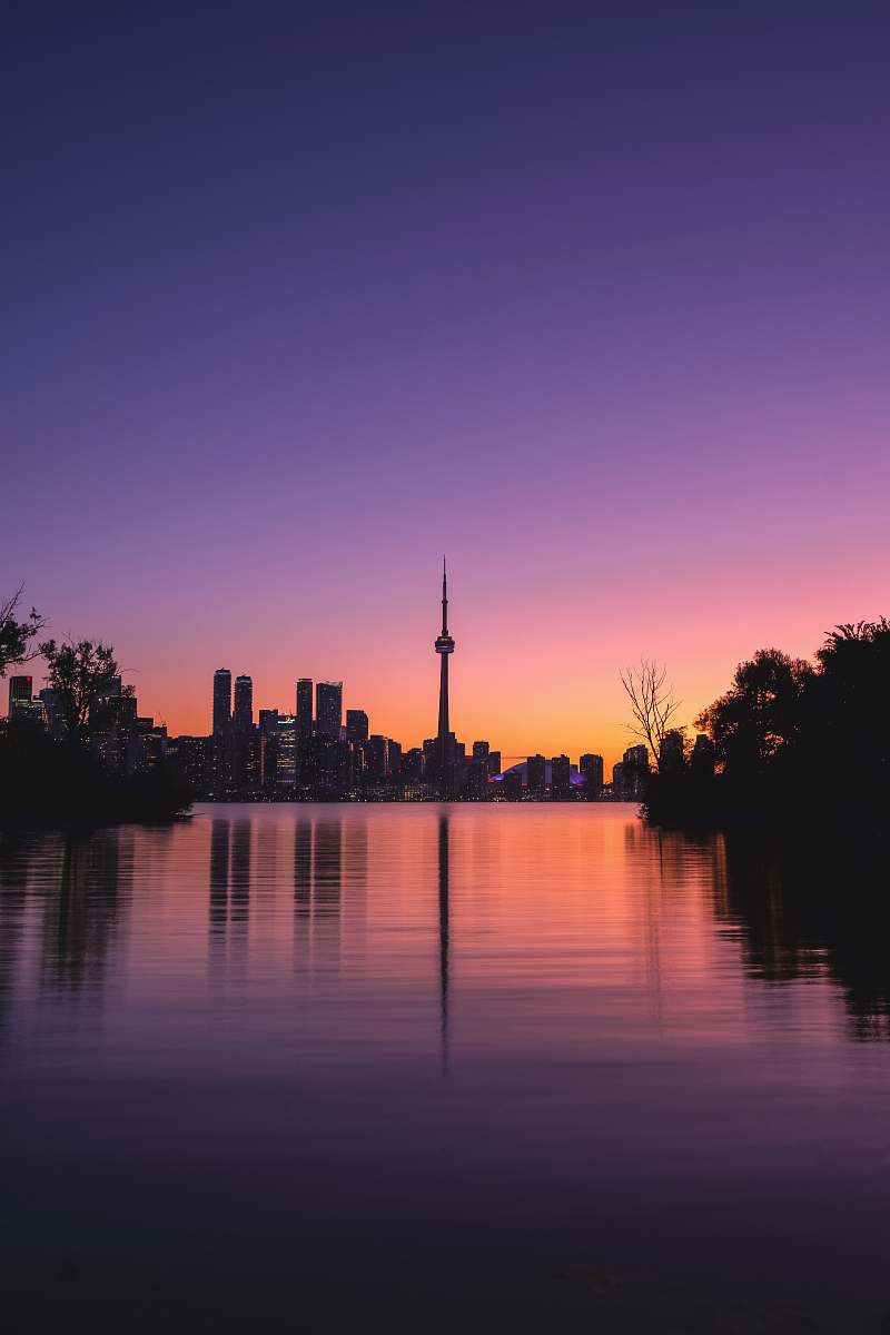 sunset silhouette of tower building sky