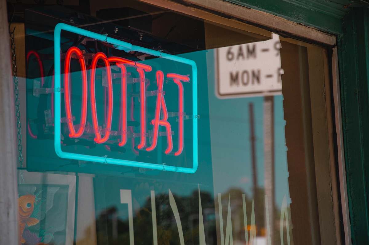 light lighted red and green Tattoo neon signage sign