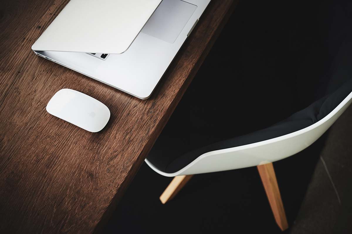 workspace white Apple Magic mouse on brown table furniture