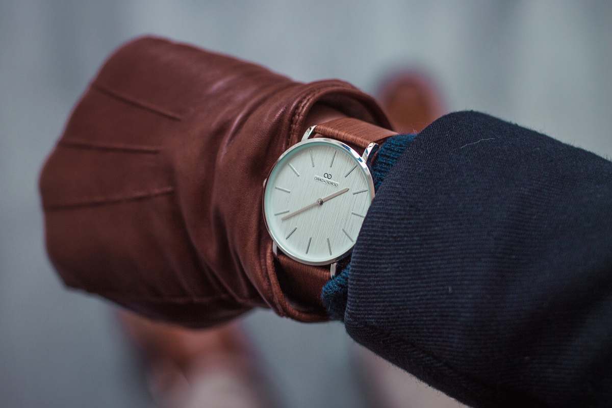 netherlands person looking at round white analog watch at 10:22 watch