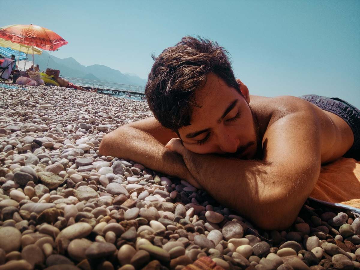 person unknown person lying outdoors human