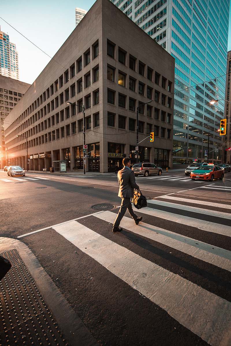 human man crossing pedestrian lane person