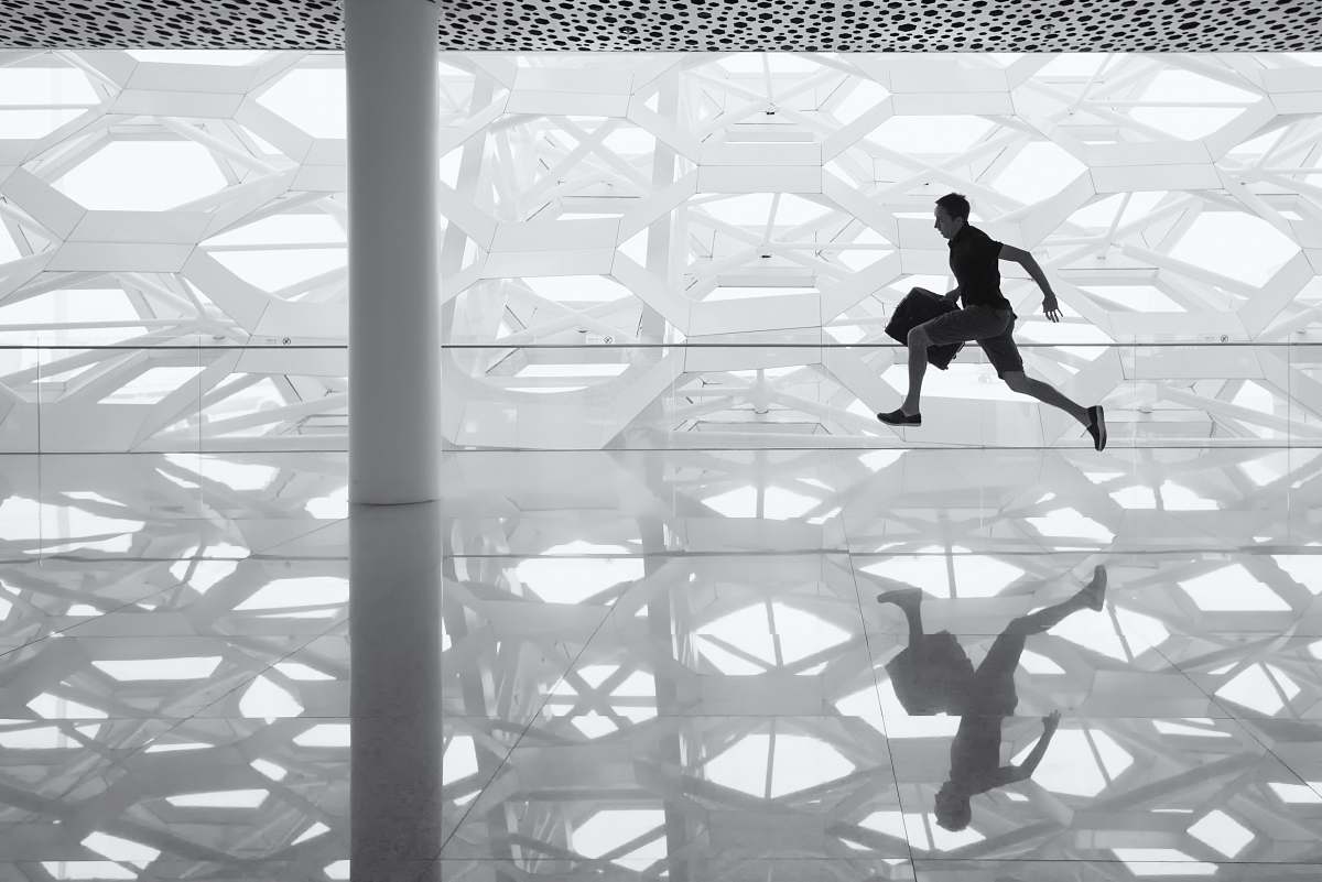 building man holding handbag late