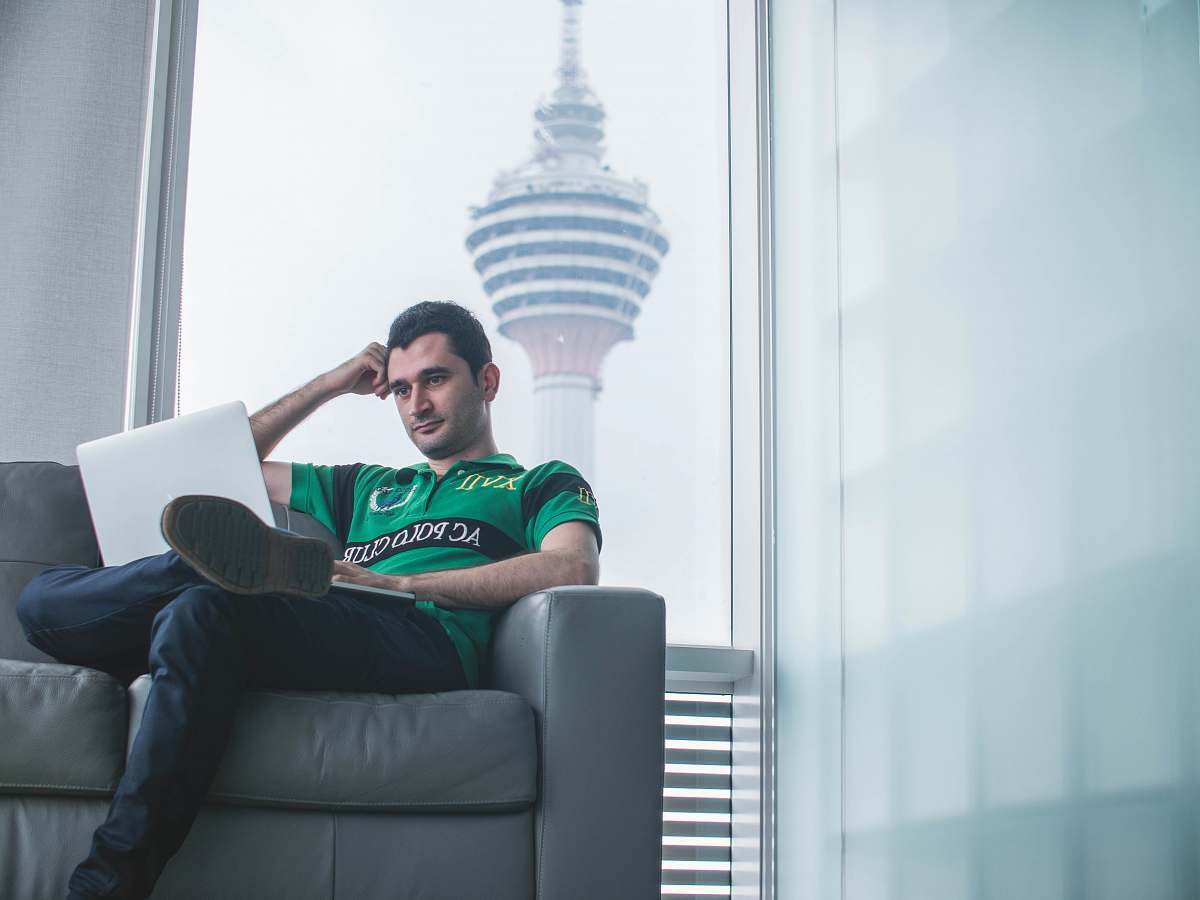 human man watching on laptop person