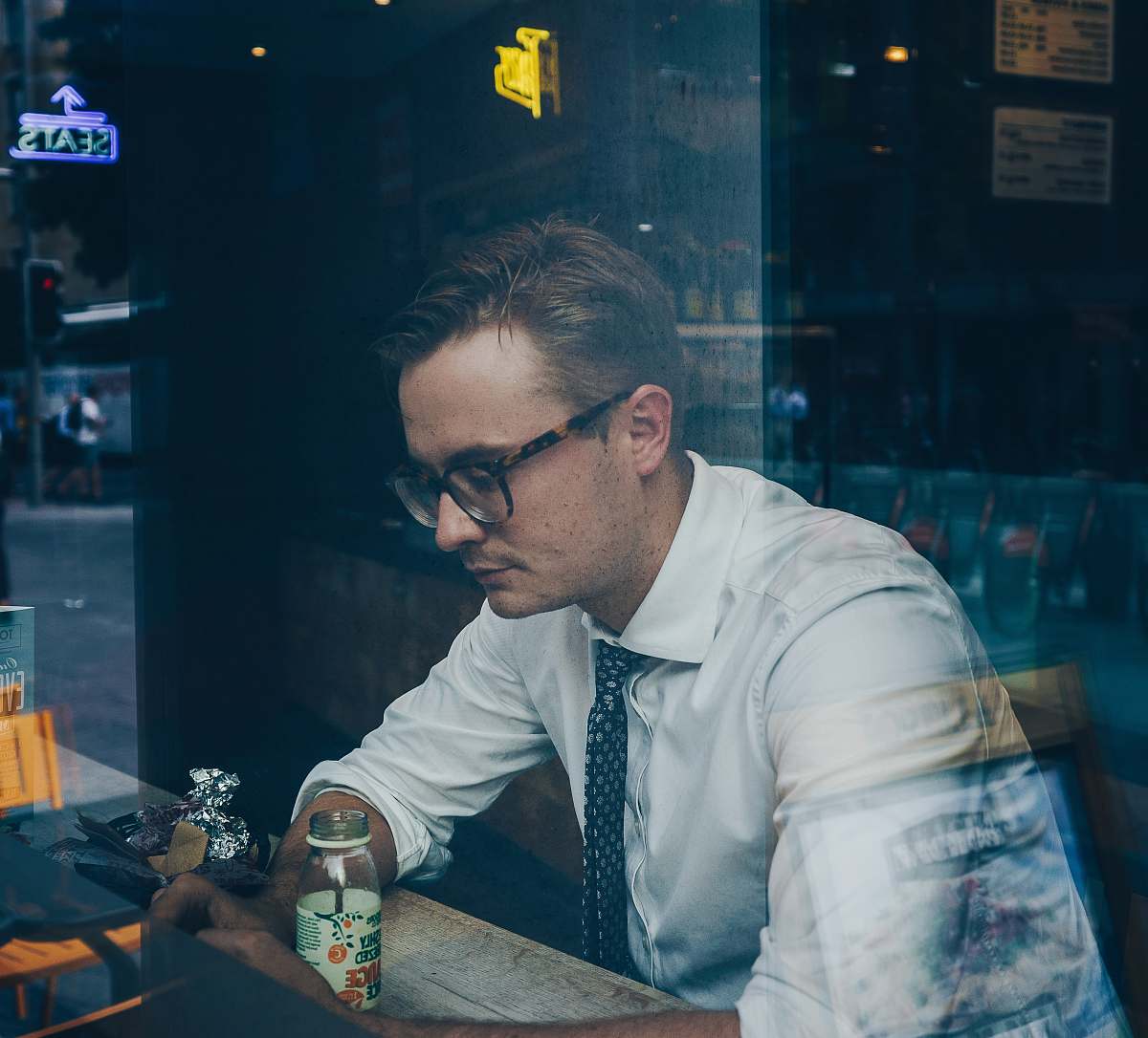 person man wearing sunglasses inside cafe human
