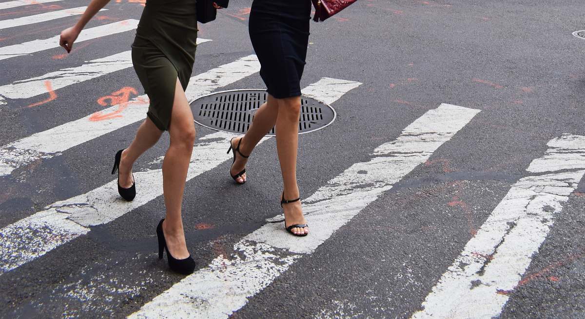 person two women walking on pedestrian lane human