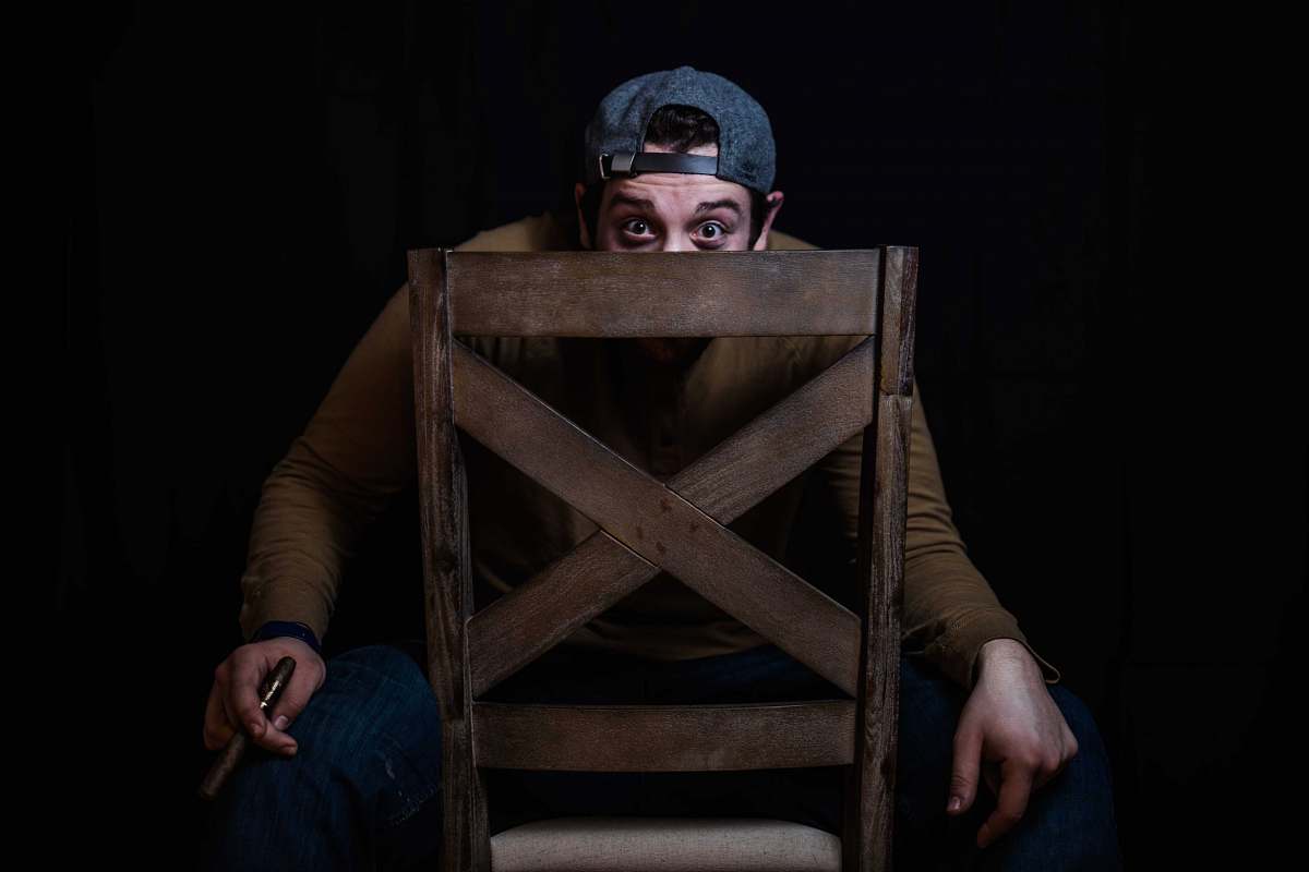 chair man in brown jacket sitting on chair furniture