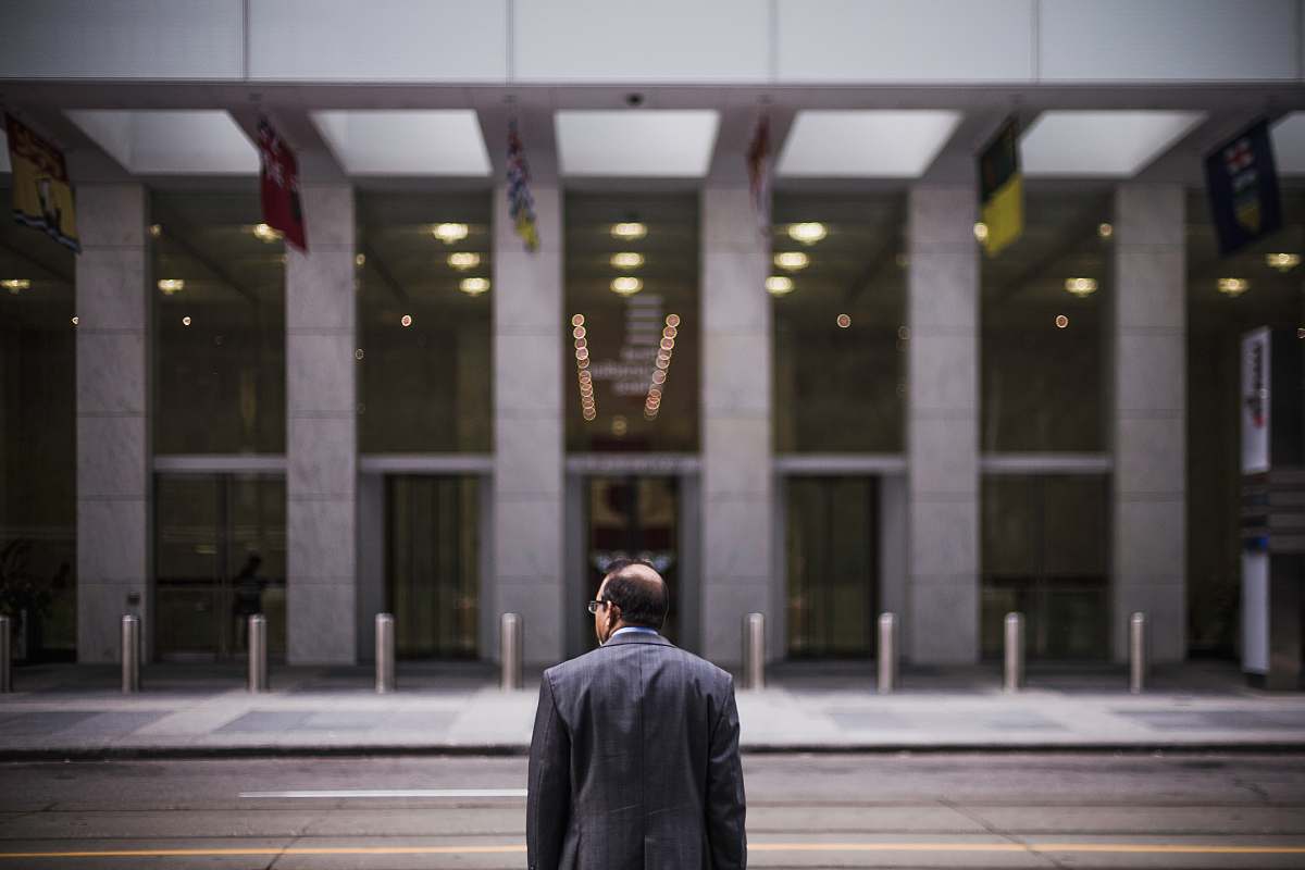 people man standing in front of building building