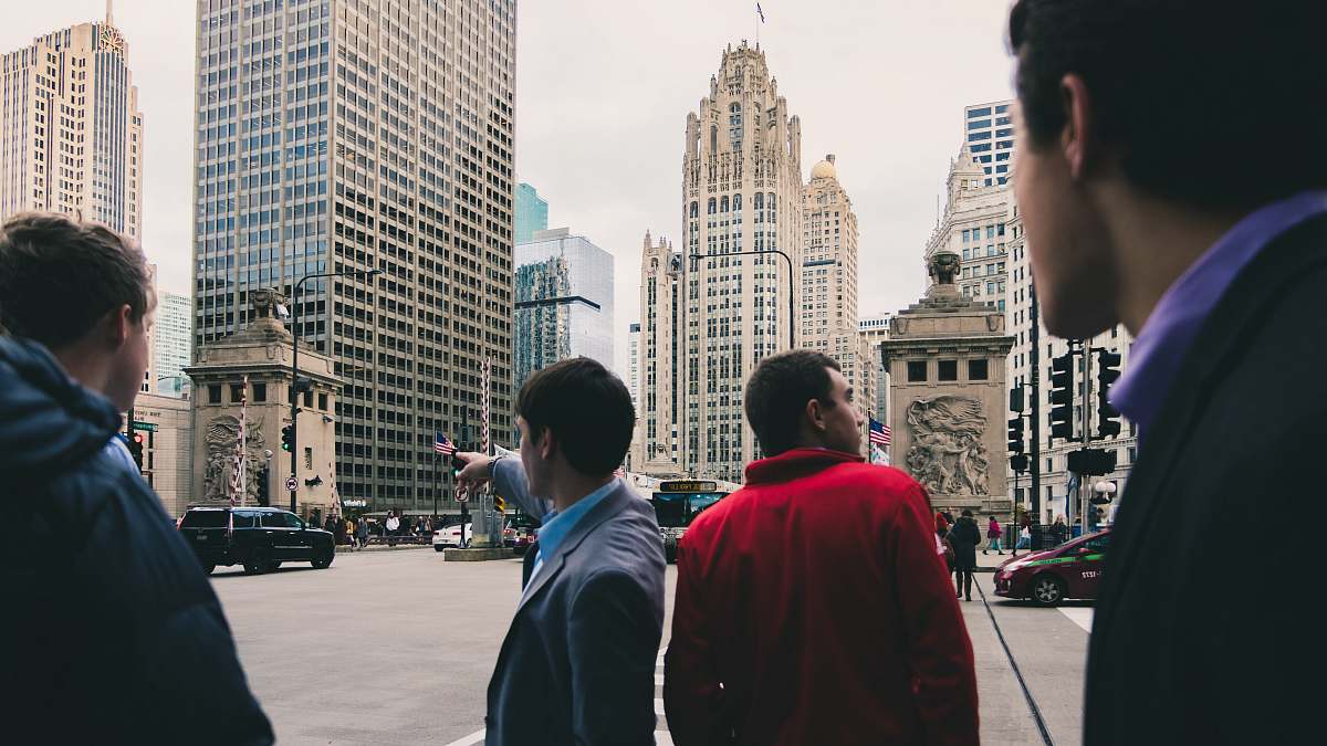 human men standing near road people