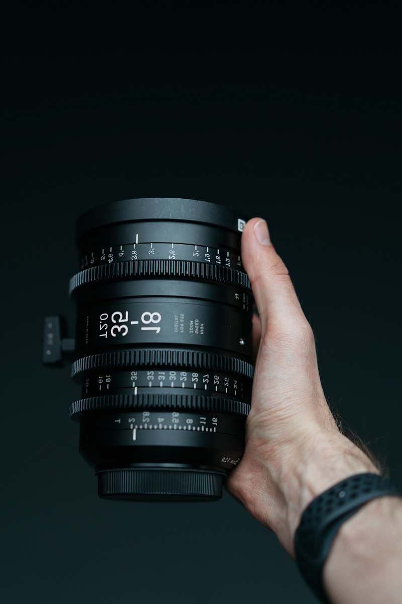 human person holding camera lens camera