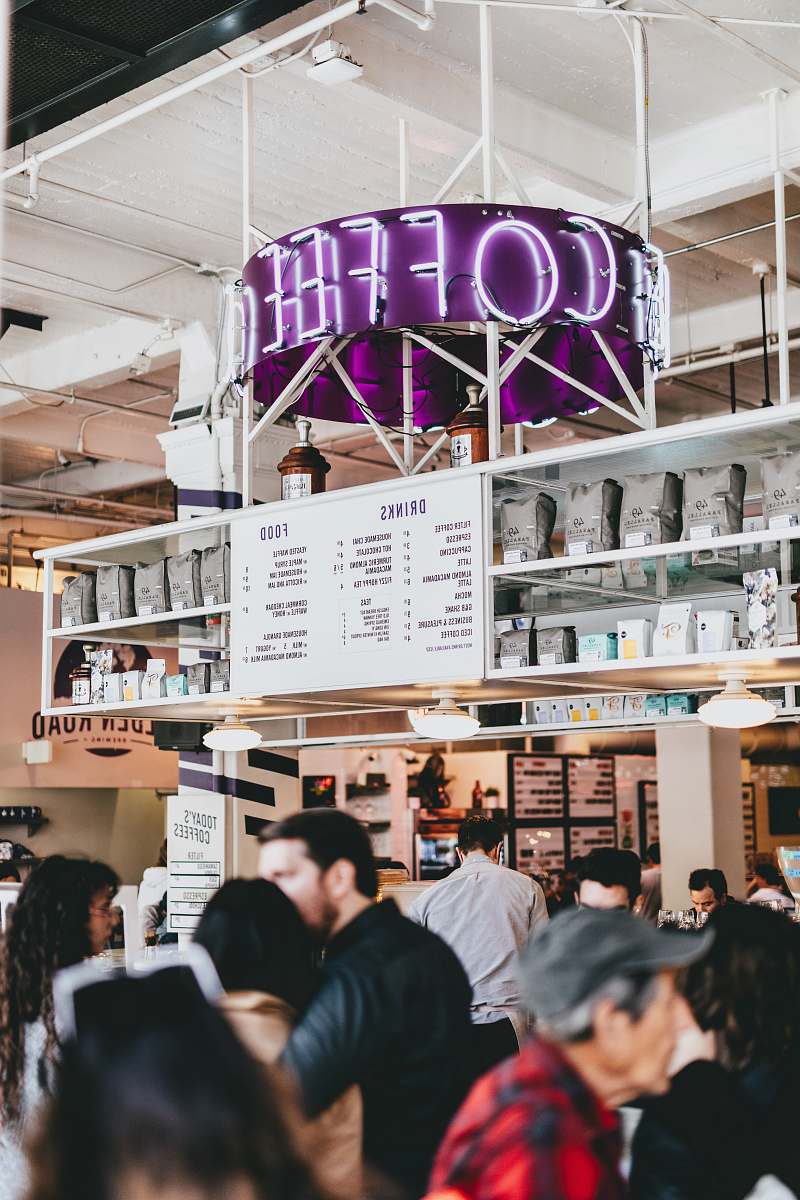 human photo of lighted coffee neon light signage people