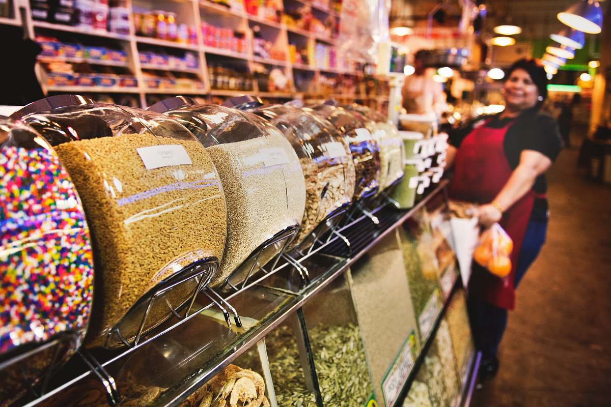 human shallow focus photo of candy jars people