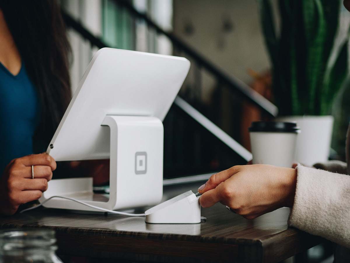 human white monitor on desk chip reader