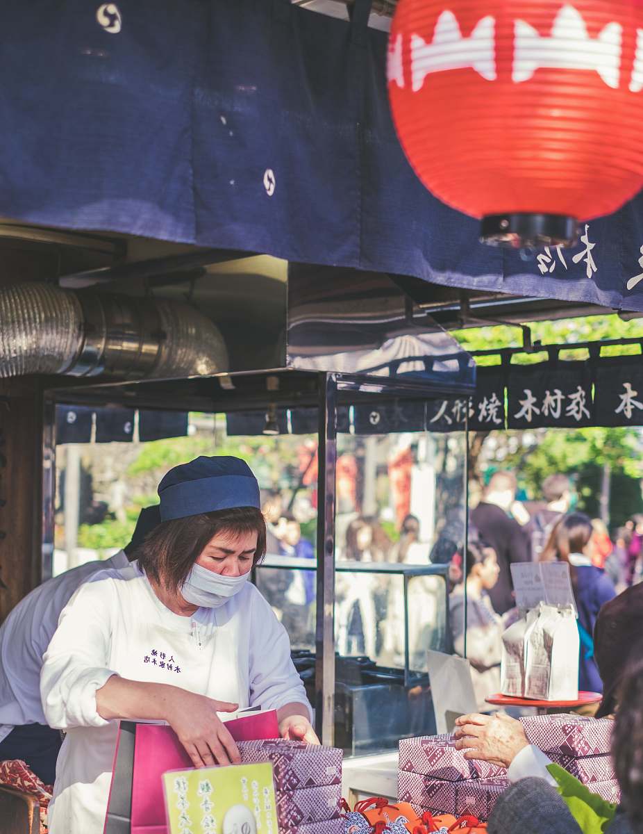 people woman holding boxes standing beside man human