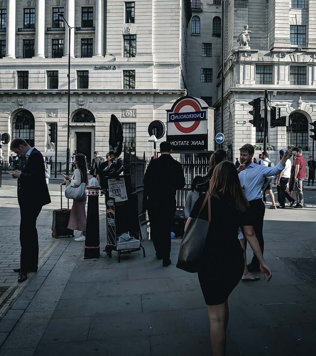 pedestrian woman in black at a sidewalk human