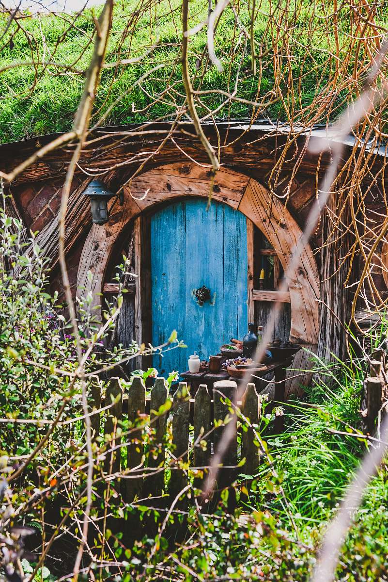 door blue door on brown house jar