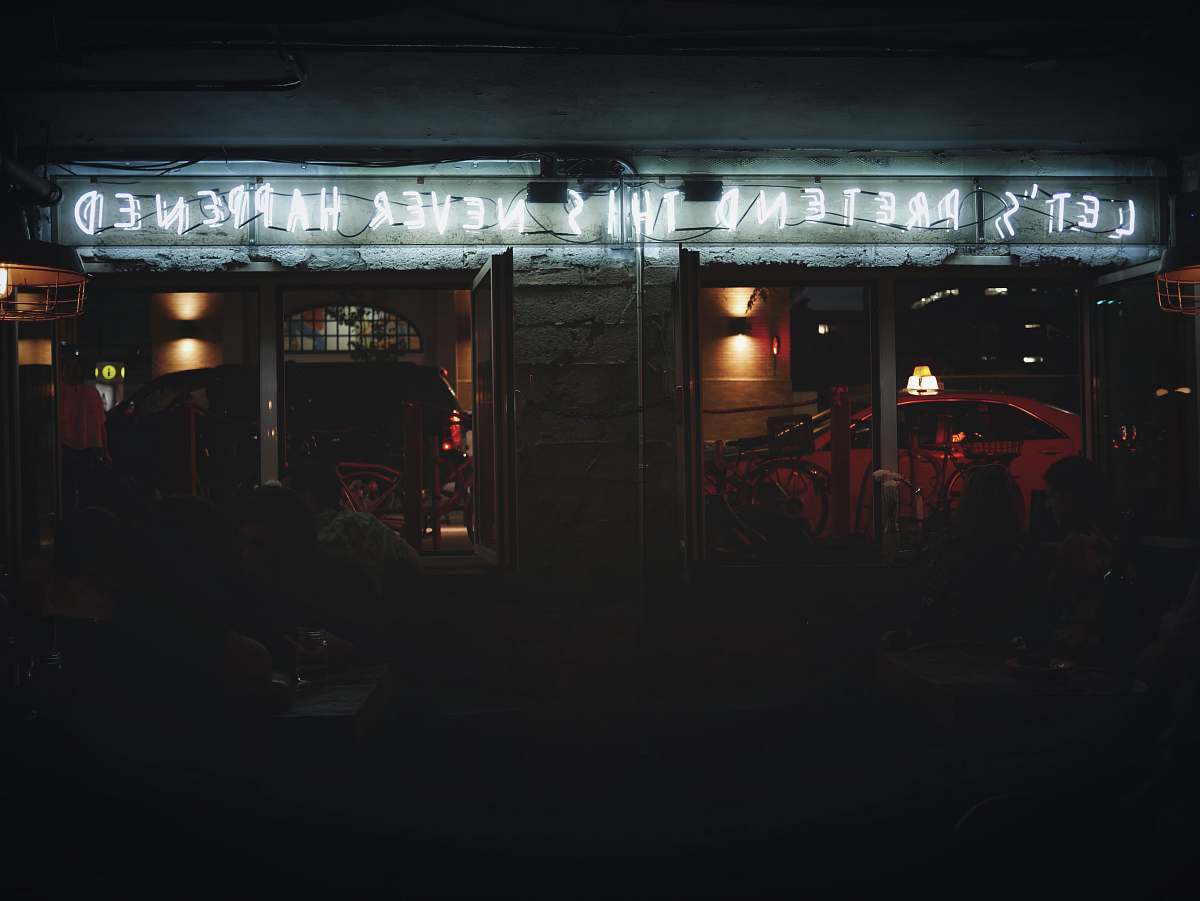 neon focus photo of Let's Pretend This Never Happened neon light signage toronto