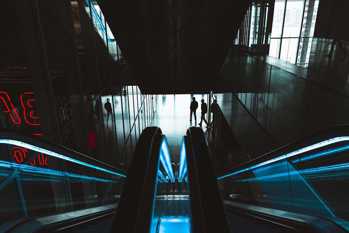 netherlands person standing near empty escalator blue