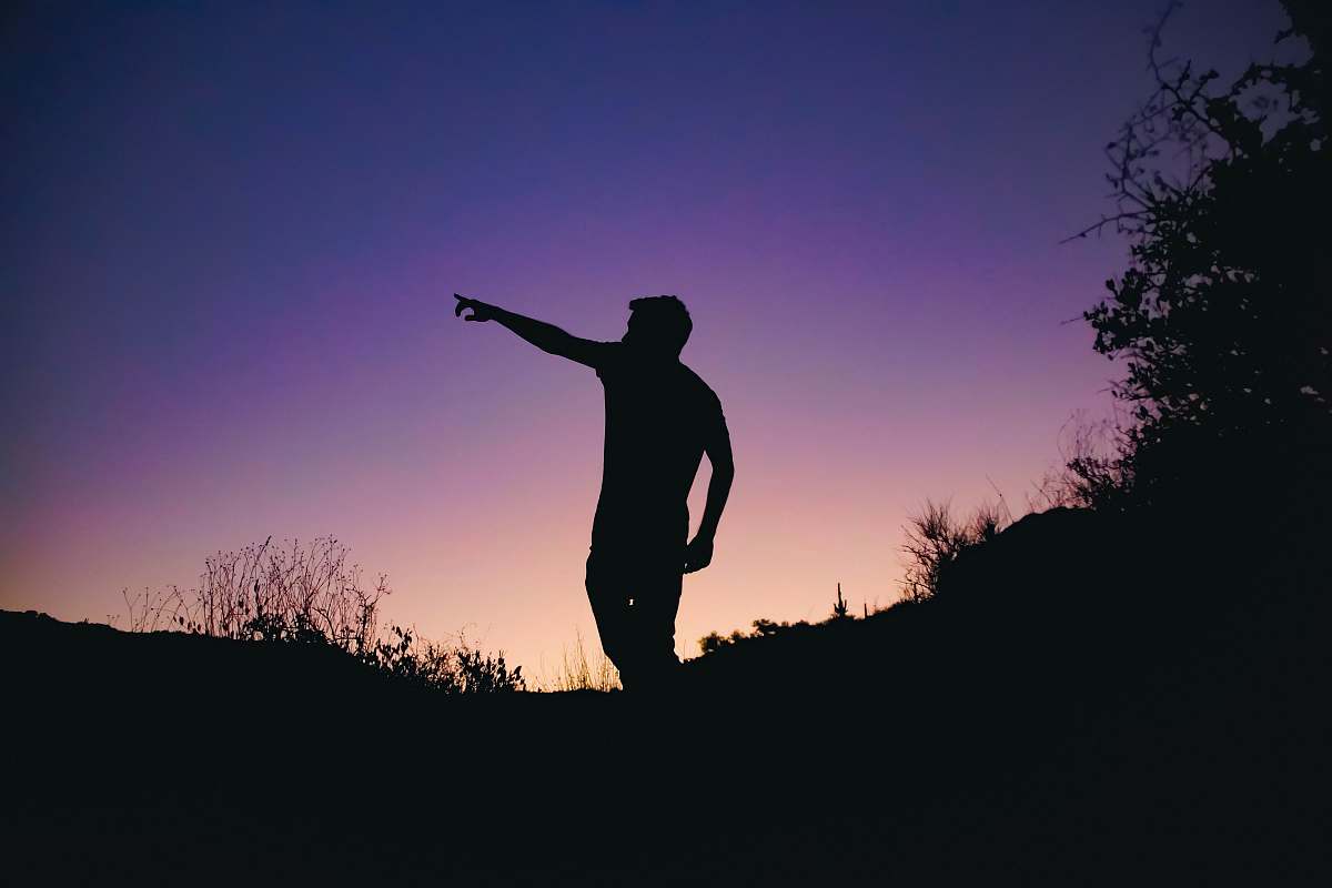 wallpaper man in silhouette photo standing on cliff pointing